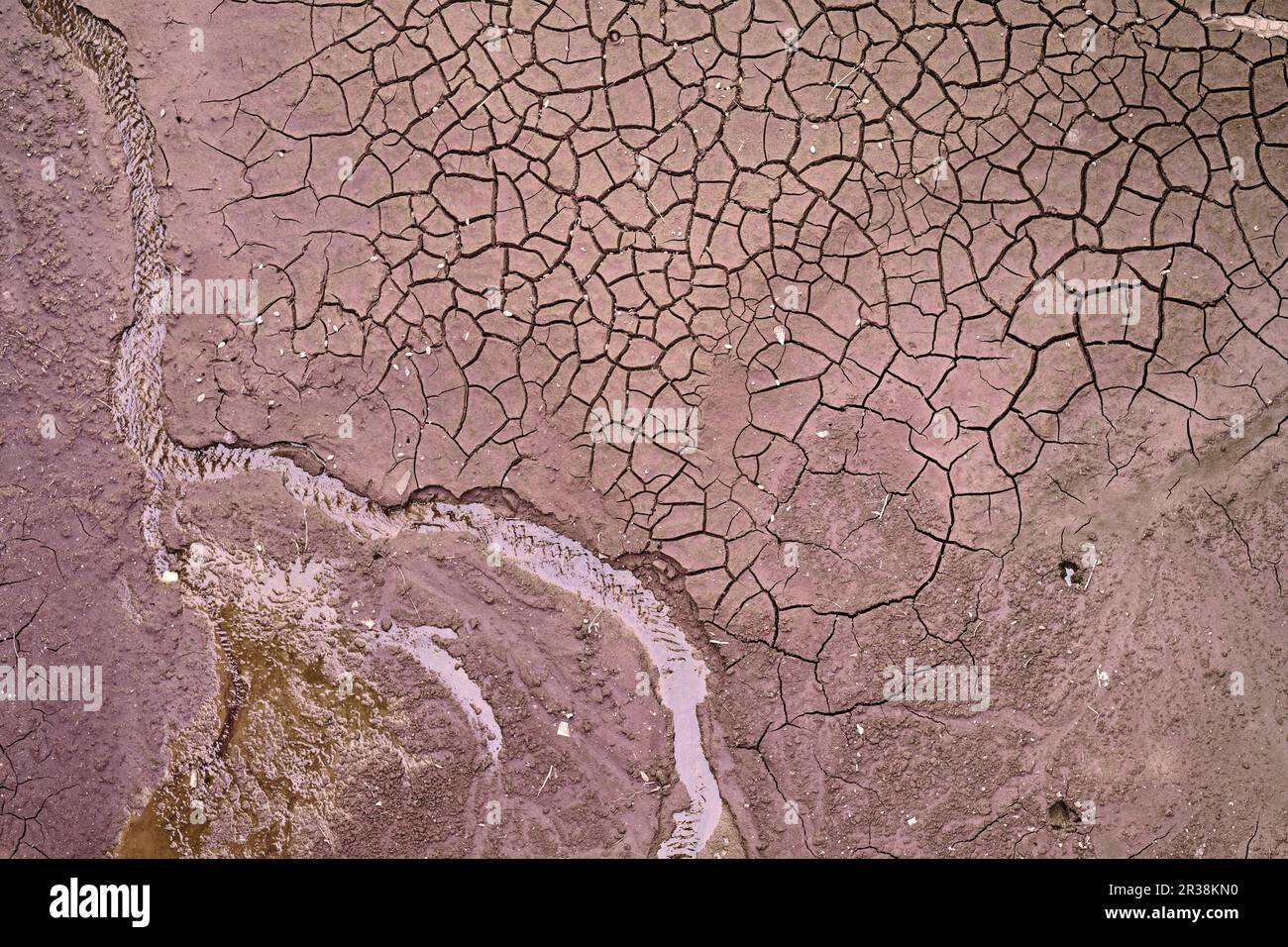 Top drone view on cracked dry soil on the river or sea bottom with a ...