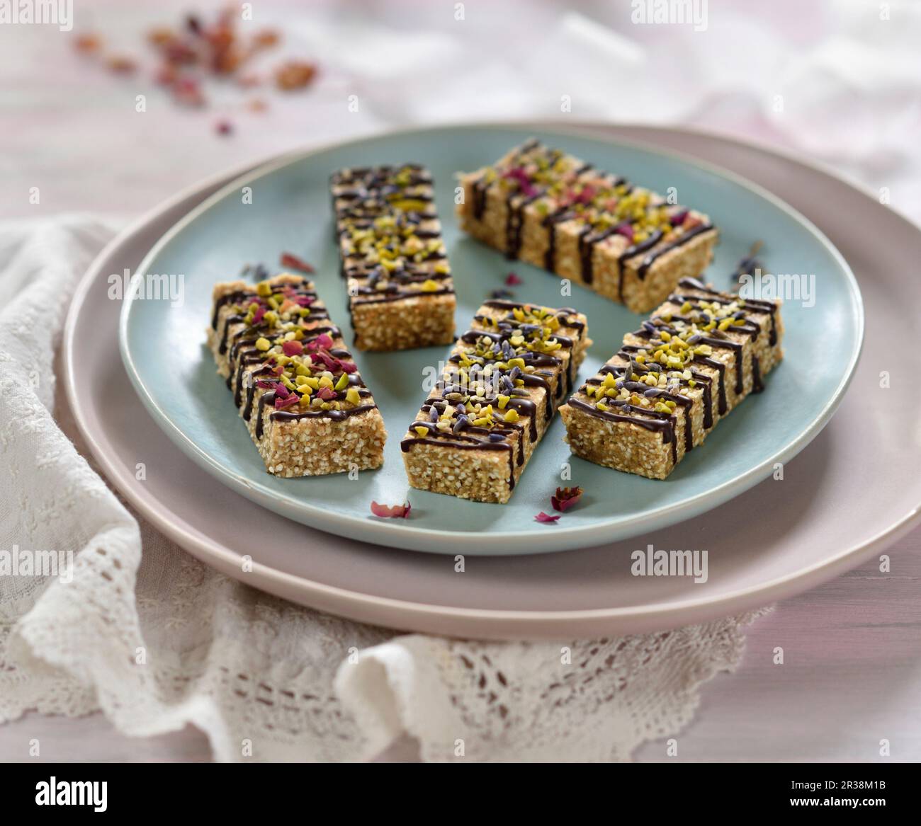 Vegan amaranth and almond bars with chocolate, dried flowers