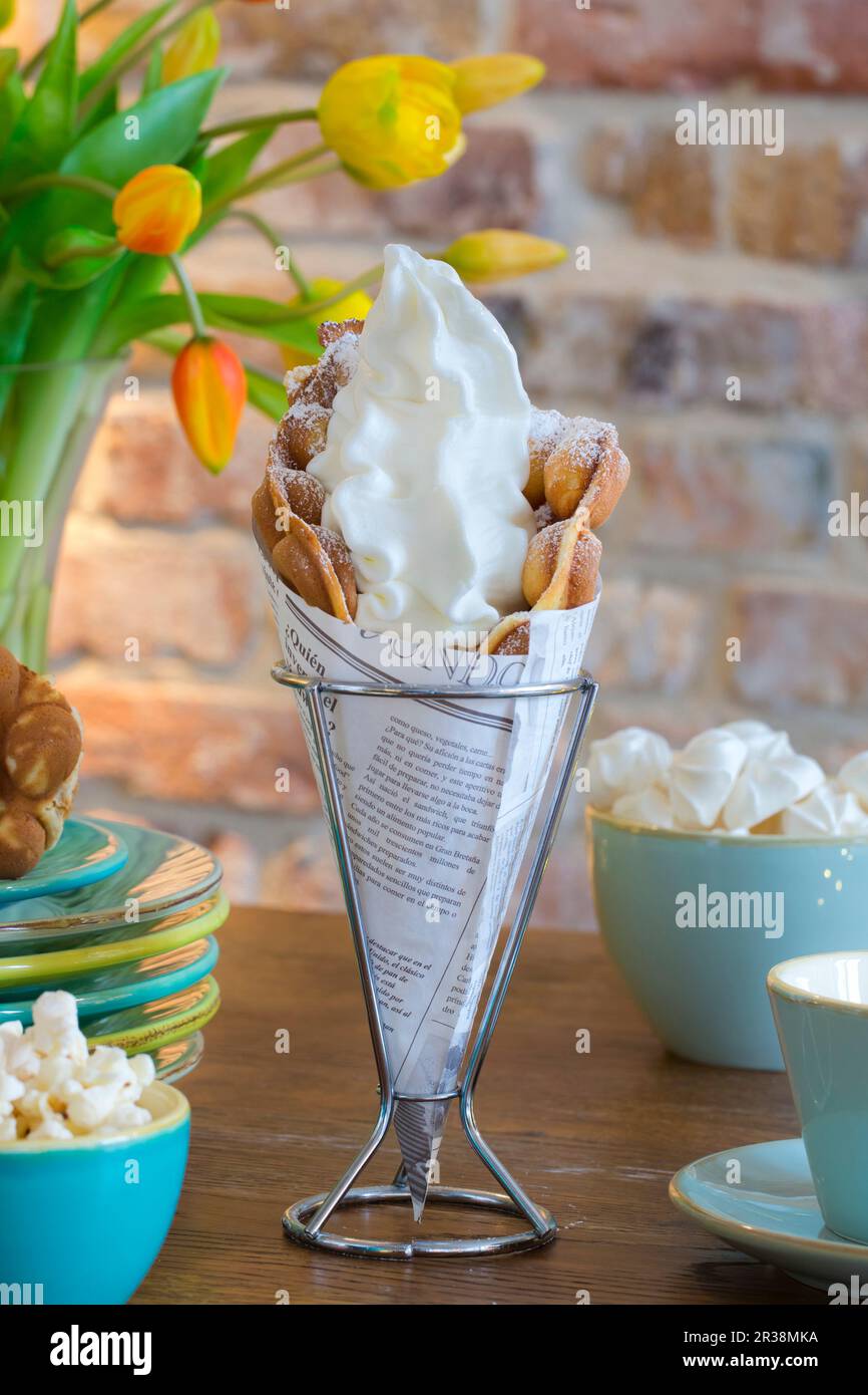 A bubble waffle with frozen yoghurt Stock Photo