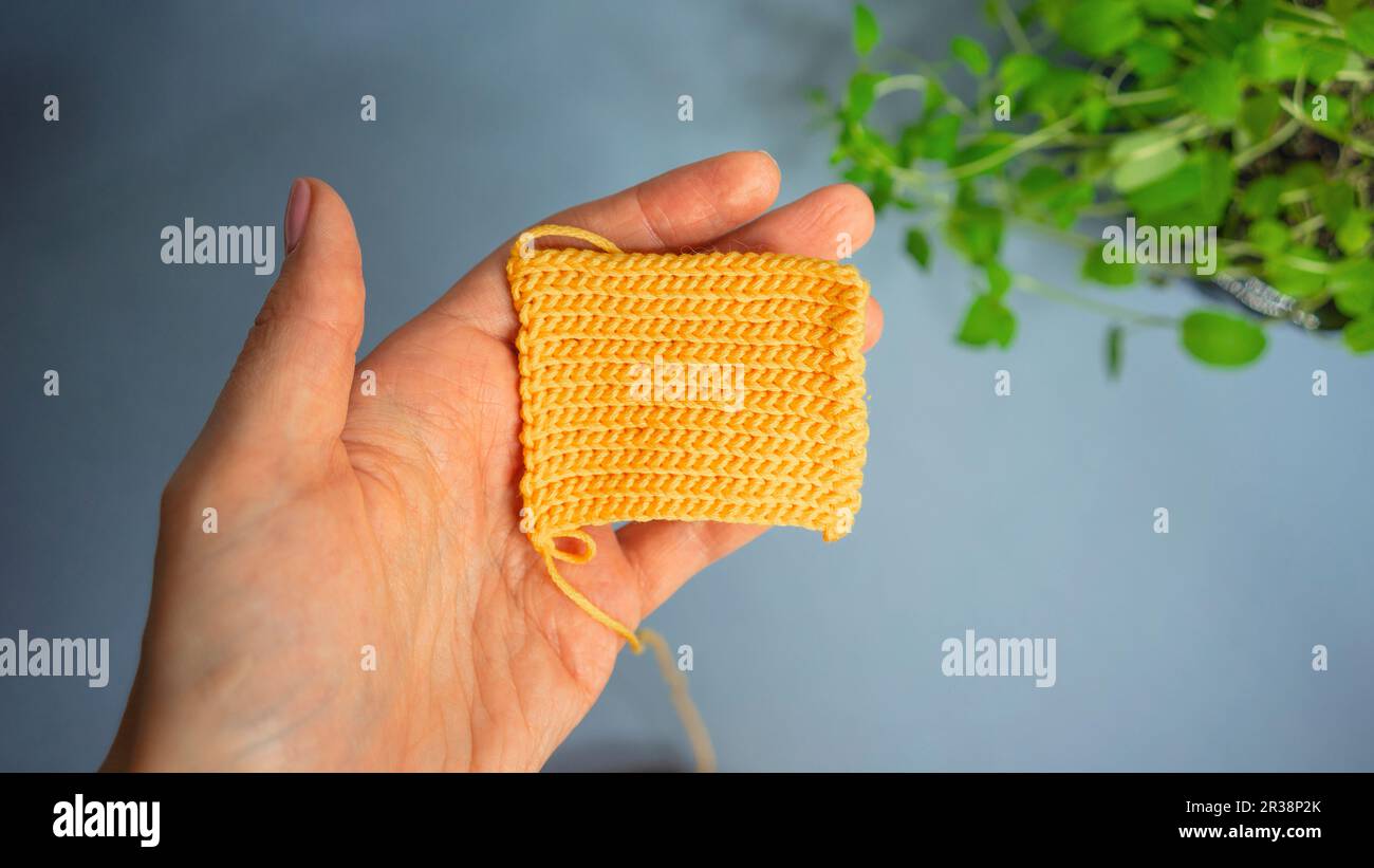 Crochet knit pattern, hands of the master Stock Photo
