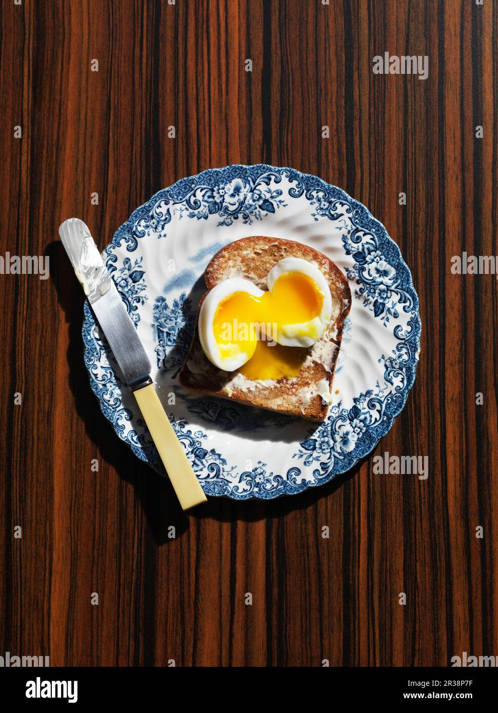A soft egg on toast Stock Photo
