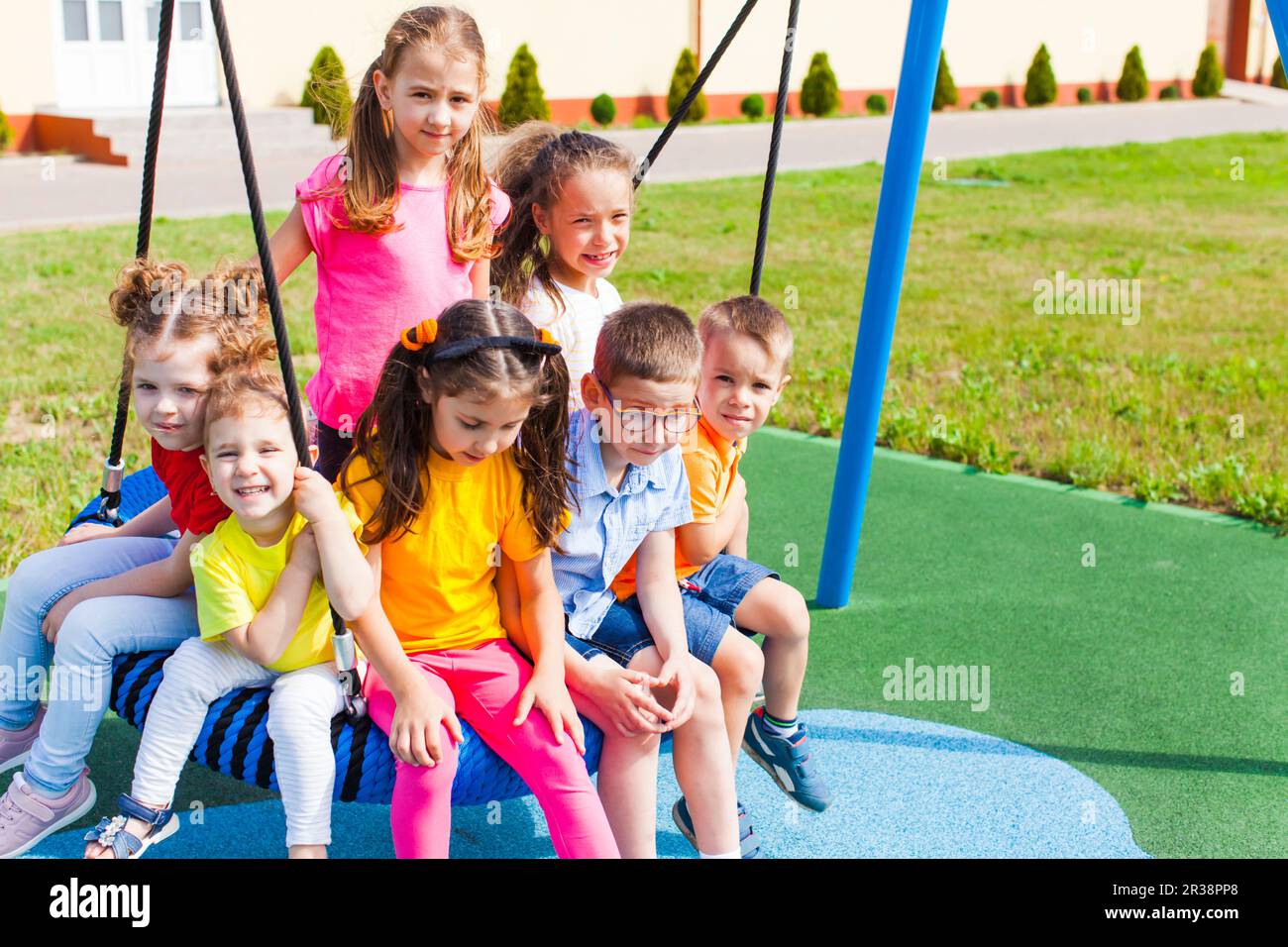 Kids sit quietly outdoors in the summer Stock Photo