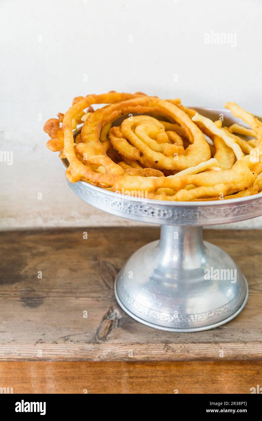 Deepfried pastries on a cake stand Stock Photo Alamy