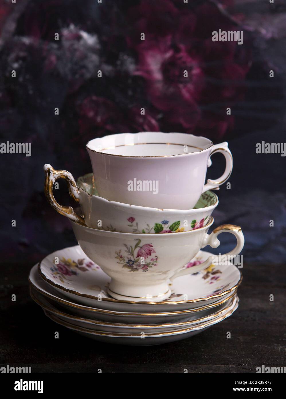 Three vinatge fine bone china tea cups and saucers stacked Stock Photo