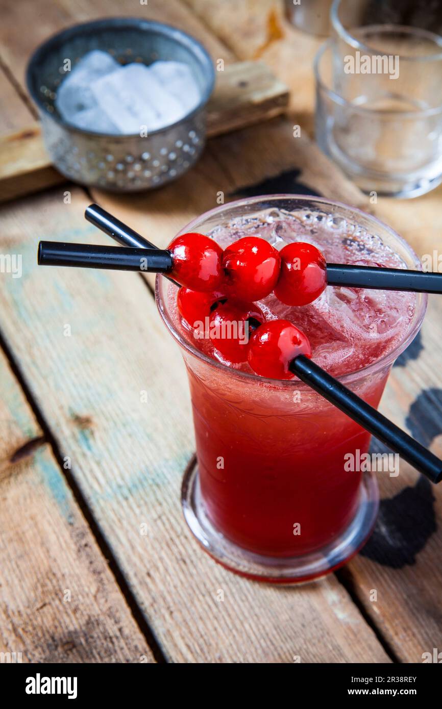 A Singapore Sling with cherry liqueur Stock Photo