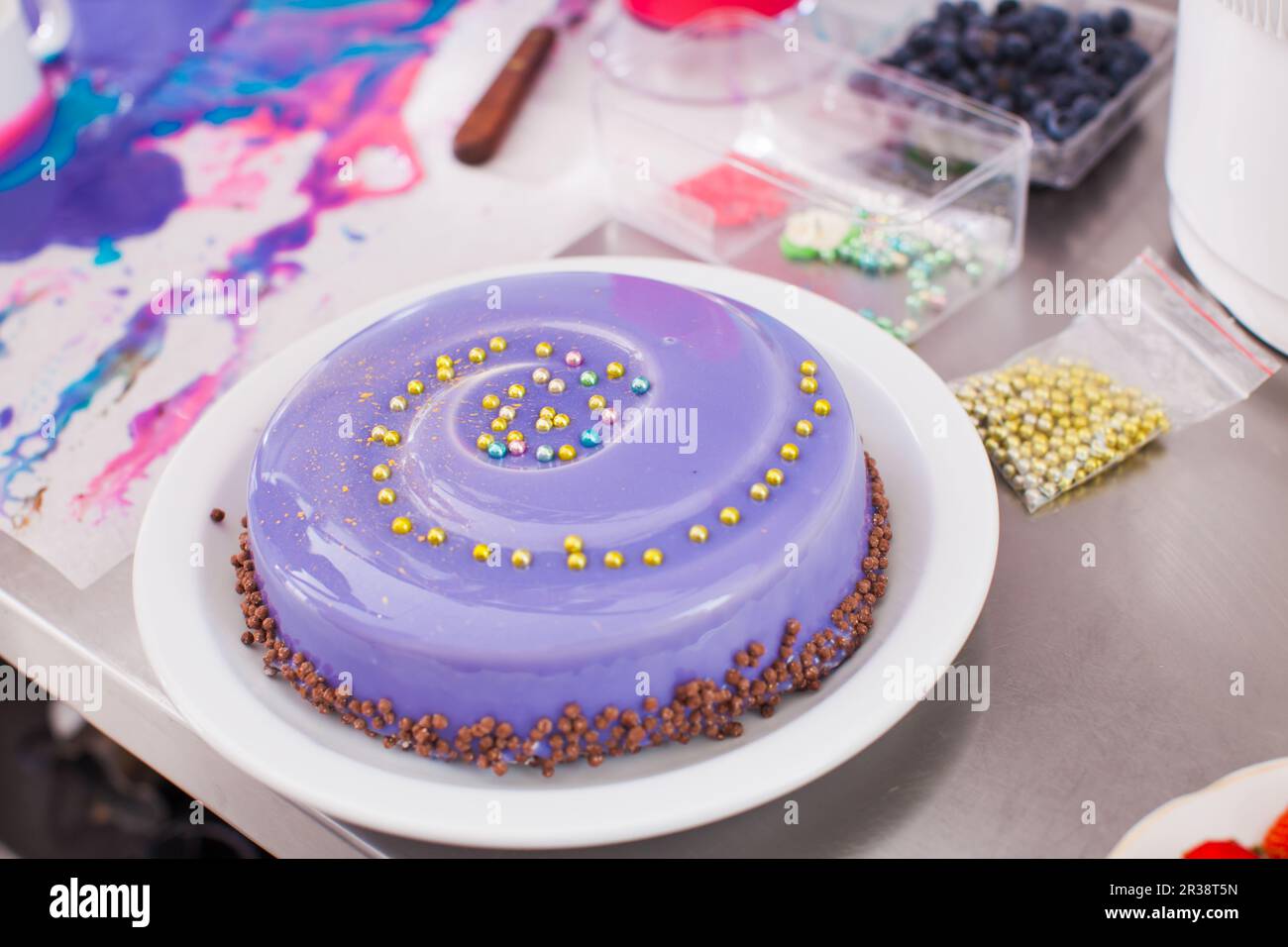 Process of decorating cake with mirror glaze Stock Photo