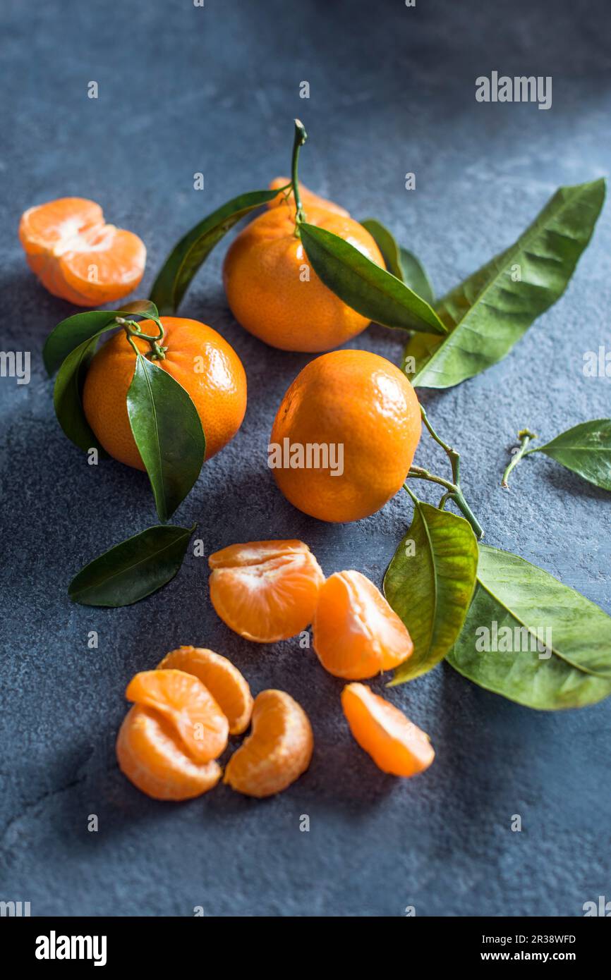 Mandarins on a stone surface Stock Photo