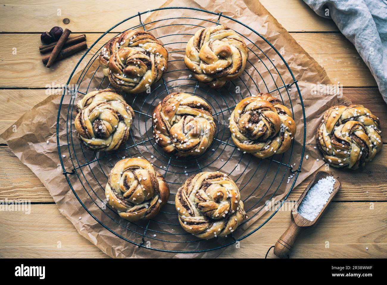 Norwegian cinnamon buns on a wire rack Stock Photo
