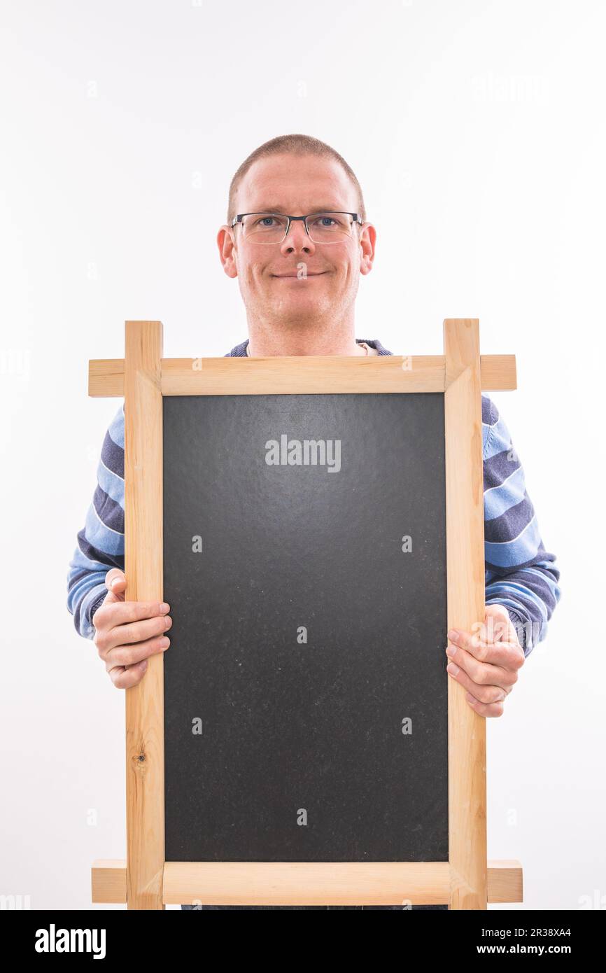 Man with black chalkboard Stock Photo