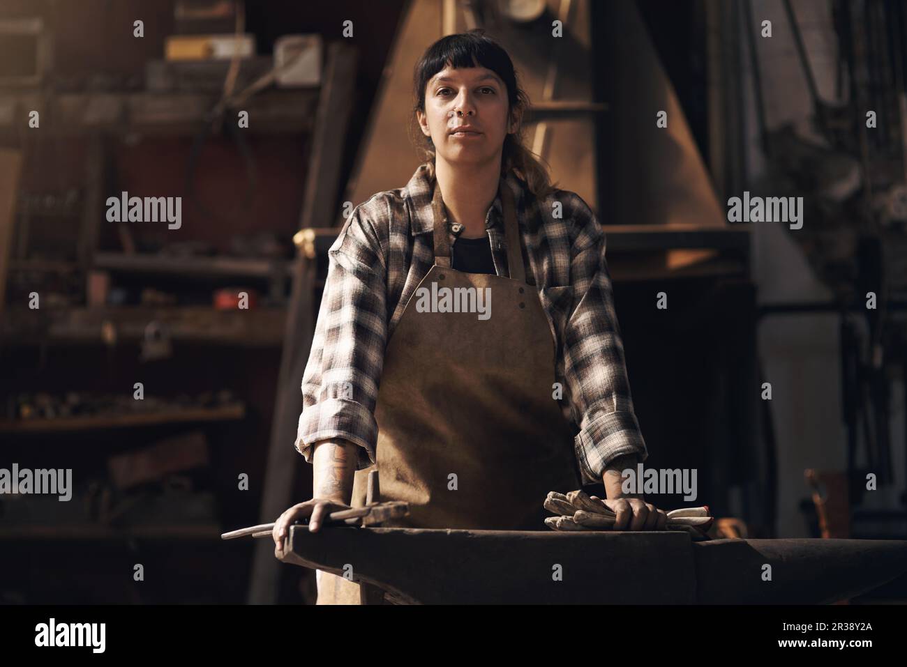 Foundry, and portrait of woman with tools for industry