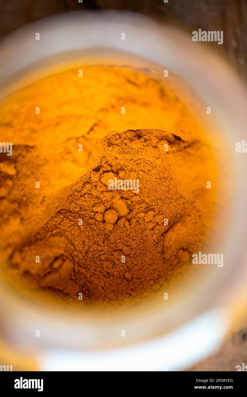 Turmeric powder (seen from above) Stock Photo