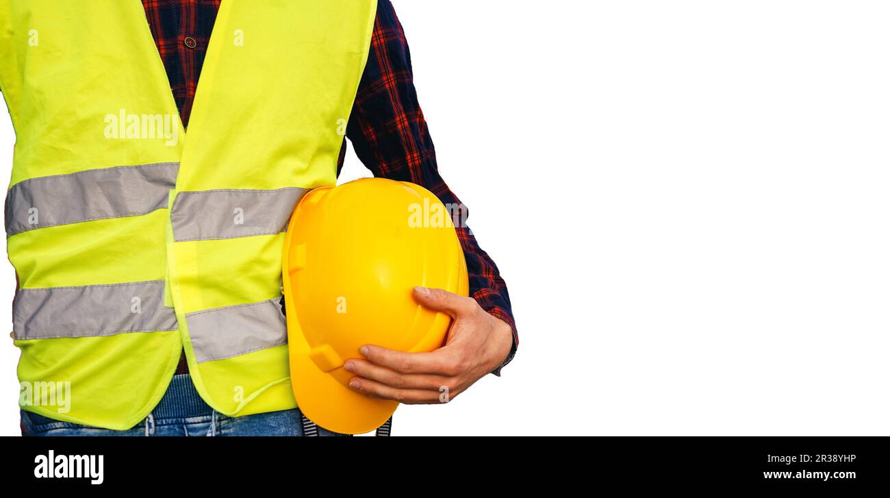 Construction worker holding yellow helmet. Building worker wearing fluorescent waistcoat. Isolated. Stock Photo