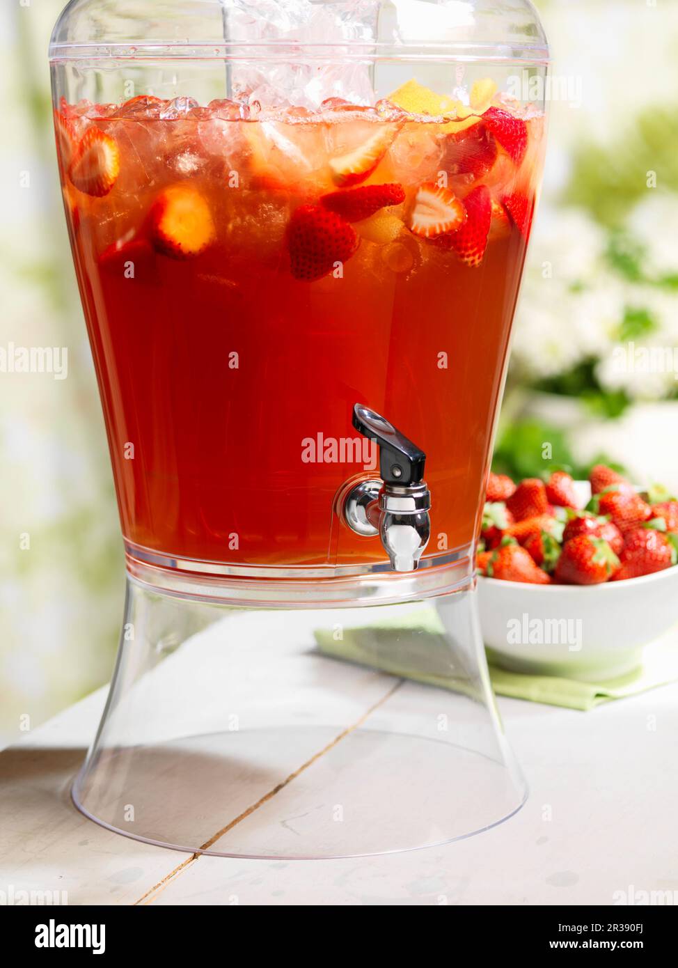 Strawberry punch in a drinks dispenser Stock Photo Alamy