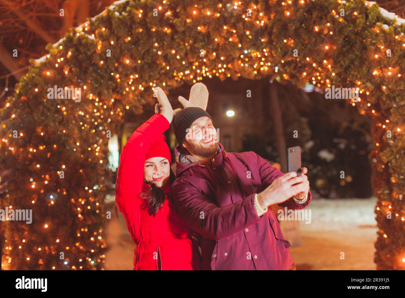 Couple making selfie having fun at Christmas evening Stock Photo