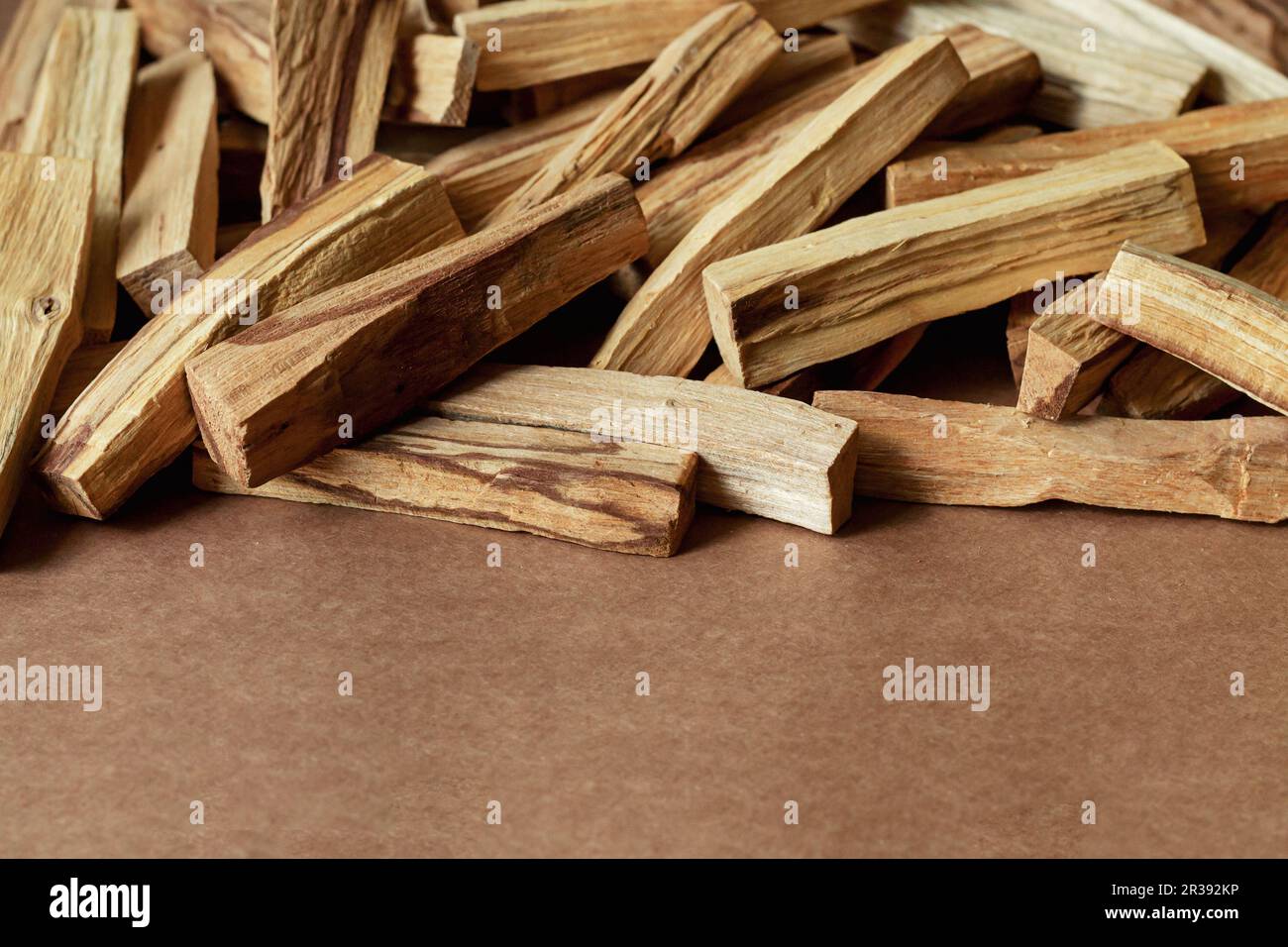 Pile of Palo Santo, holy sacred tree sticks, burning with aroma smoke