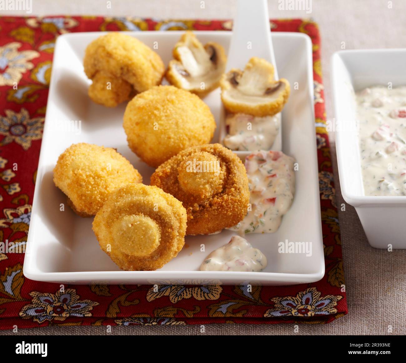 Breaded, crispy fried mushrooms with a vegetable dip made from