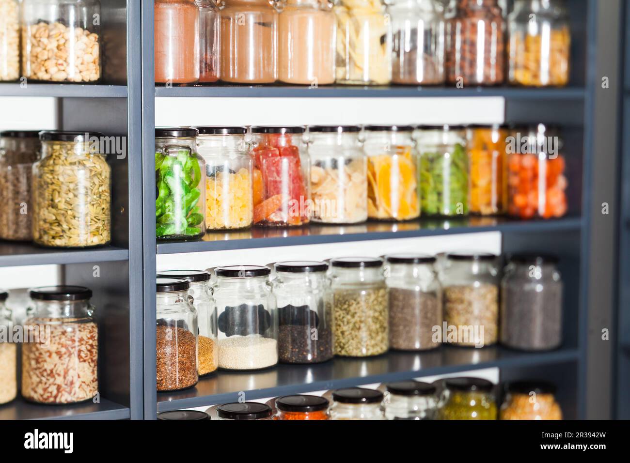 Shelf in a shop with colorful natural herbs and spices Stock Photo Alamy