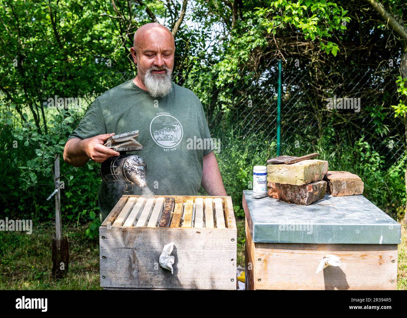 Trebivlice, Czech Republic. 22nd May, 2023. Beekeeper Ales Pelikan inspects bee hives in Trebivlice, Litomerice region, Czech Republic, May 22, 2023. The beekeeper estimates that there will be less spring honey year-on-year due to cooler weather. He expects a slight increase in price due to higher costs. Credit: Ondrej Hajek/CTK Photo/Alamy Live News Stock Photo