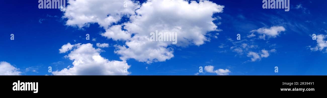 Blue sky background with white clouds. Cumulus white clouds. Panoramic image Stock Photo