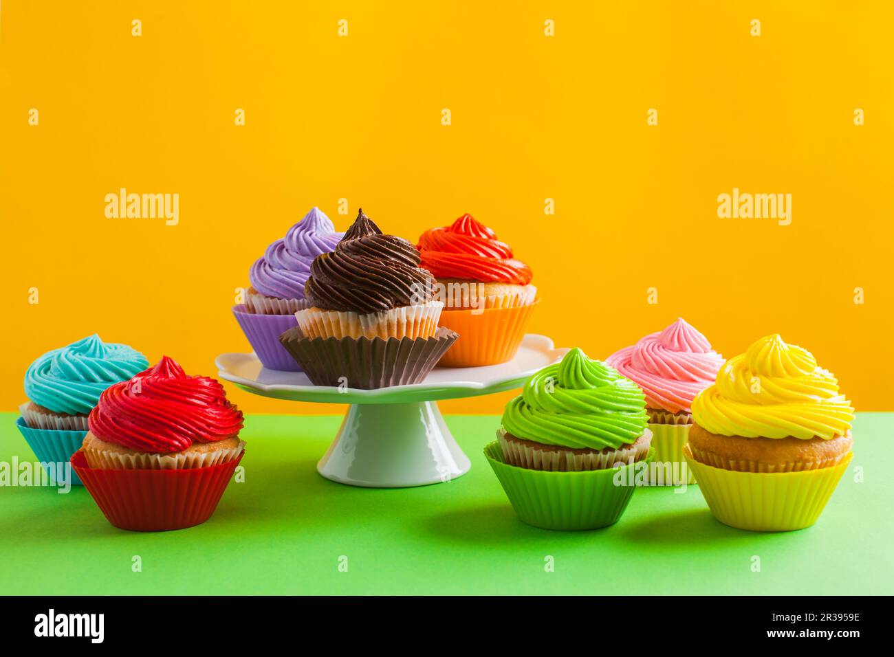Concept of variety of choice, rainbow colour cupcakes Stock Photo