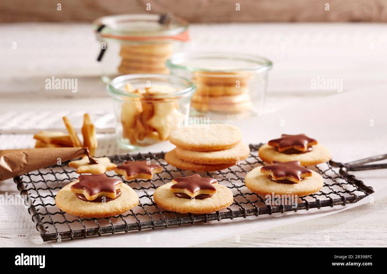 Chocolate spread sandwich biscuits topped with stars Stock Photo