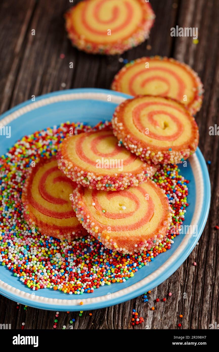 Christmas spiral biscuits with colourful sugar sprinkles Stock Photo