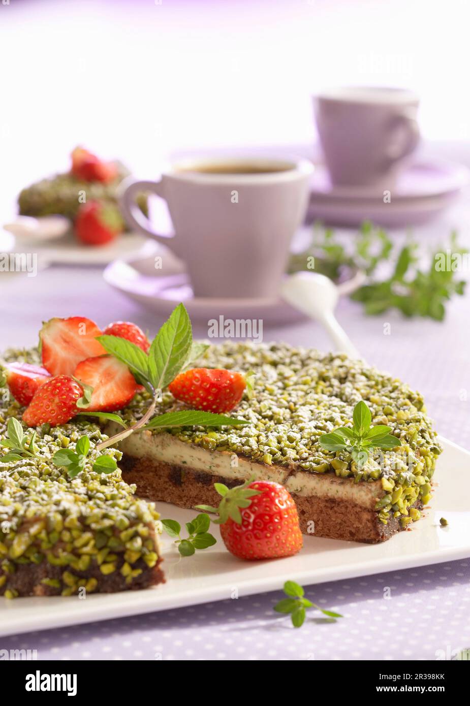 Ricotta cream cake with basil, peppermint and pistachios Stock Photo