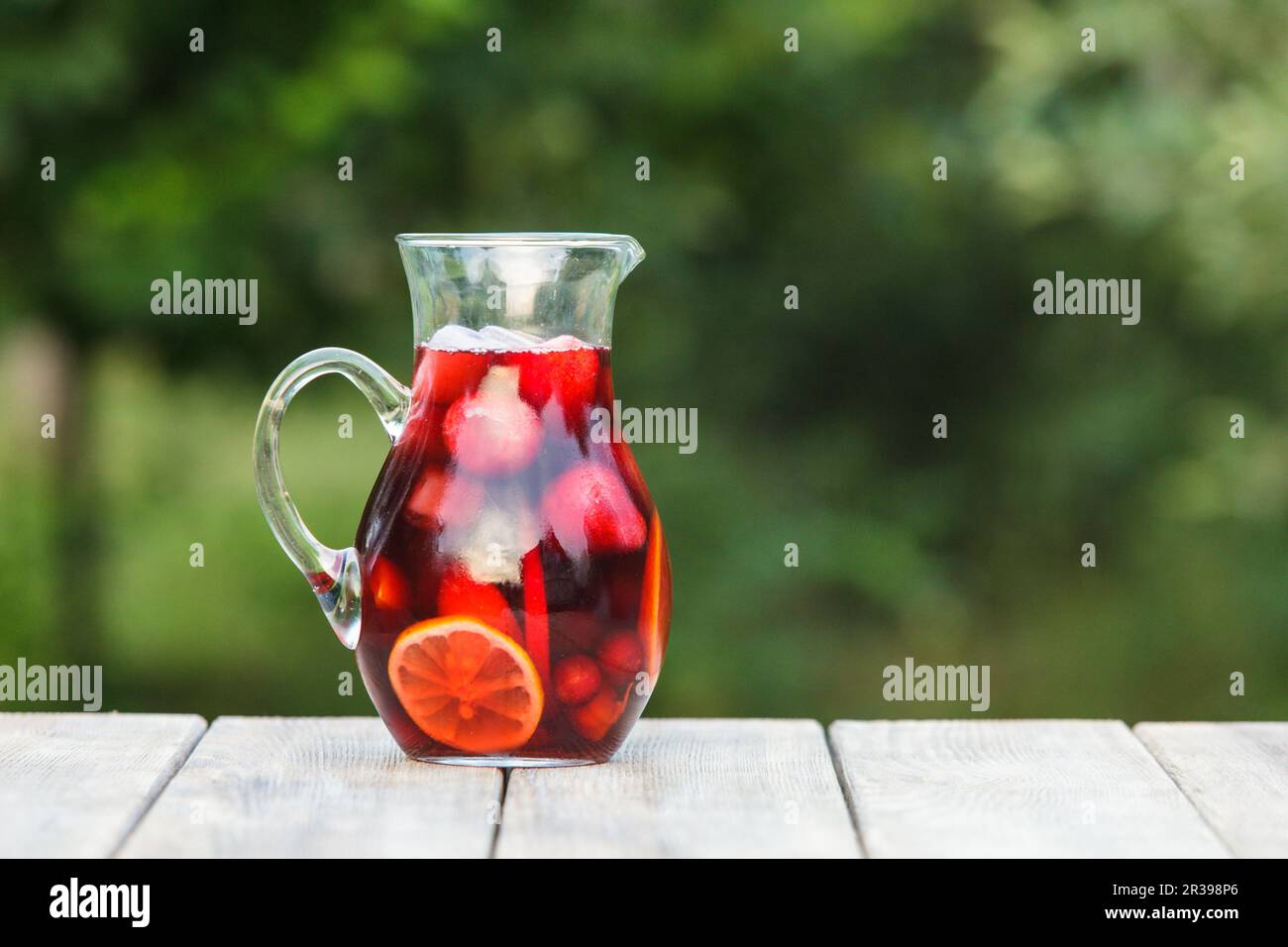https://c8.alamy.com/comp/2R398P6/refreshing-sangria-or-punch-with-fruits-in-pincher-2R398P6.jpg