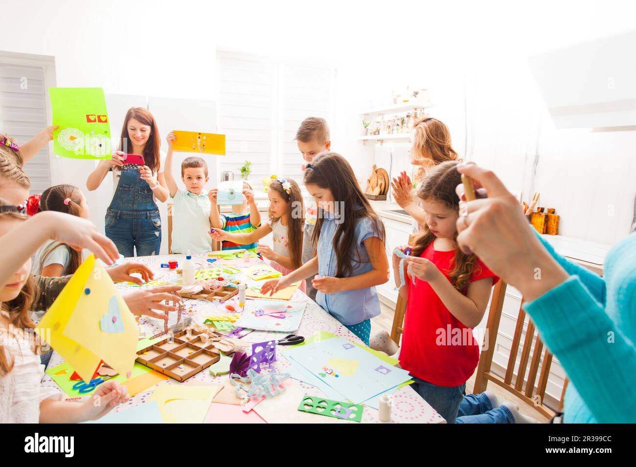 Kids doing greeting card at creative workshop Stock Photo