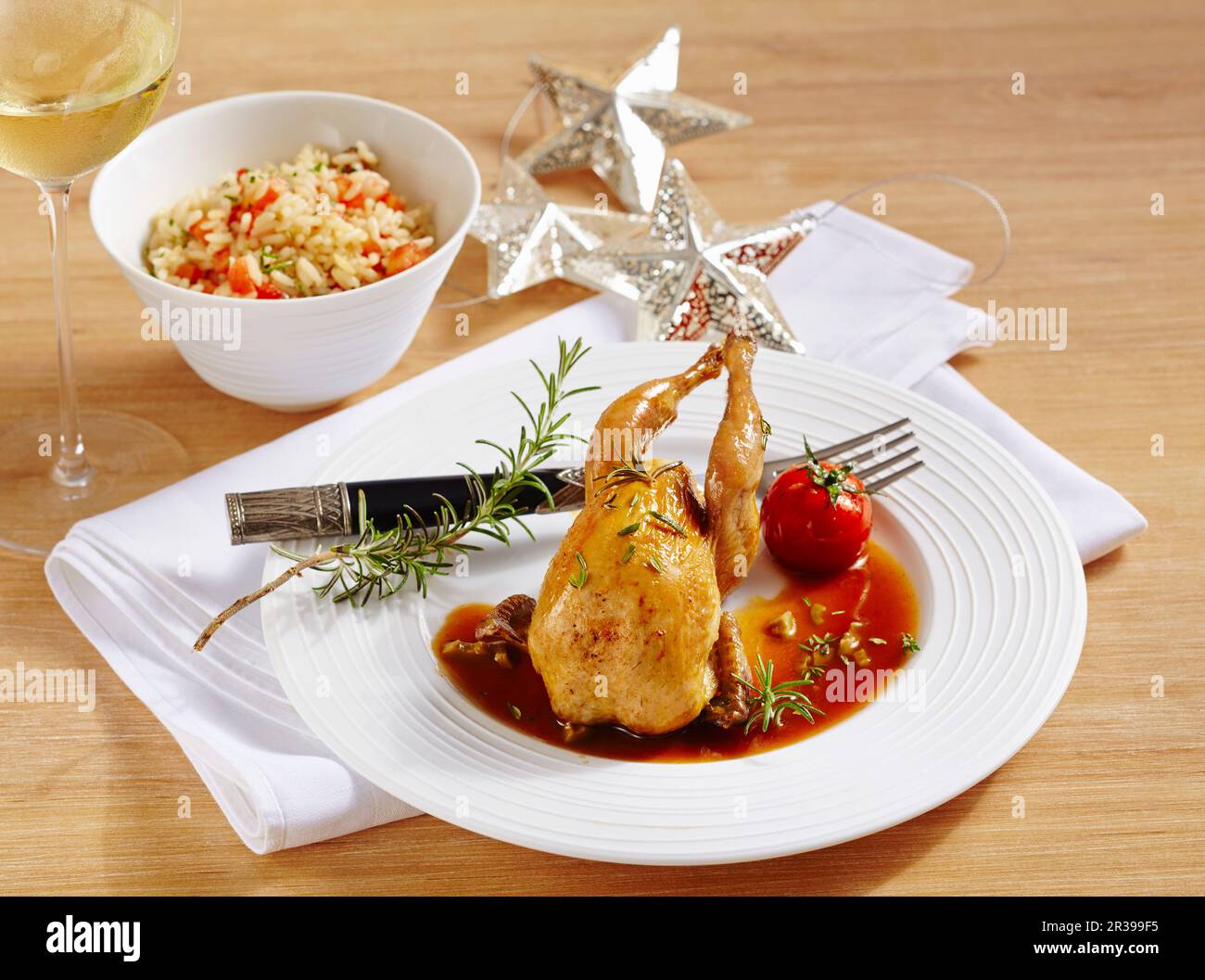 Quail With Rice Greek-style quail with pilau rice and a tomato and olive sauce Stock ...