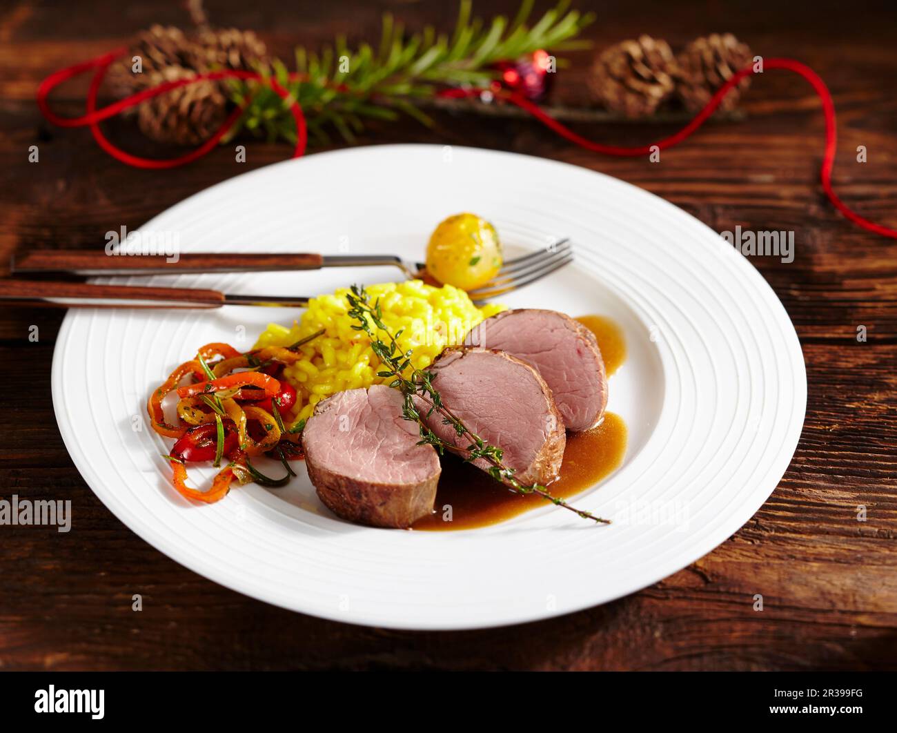 Pork fillet with saffron rice and vegetables Stock Photo Alamy