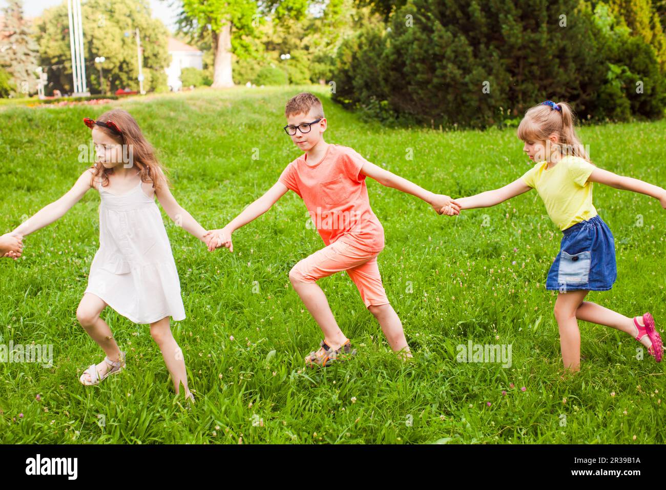 Happy children playing outdoors on a camping holiday Stock Photo