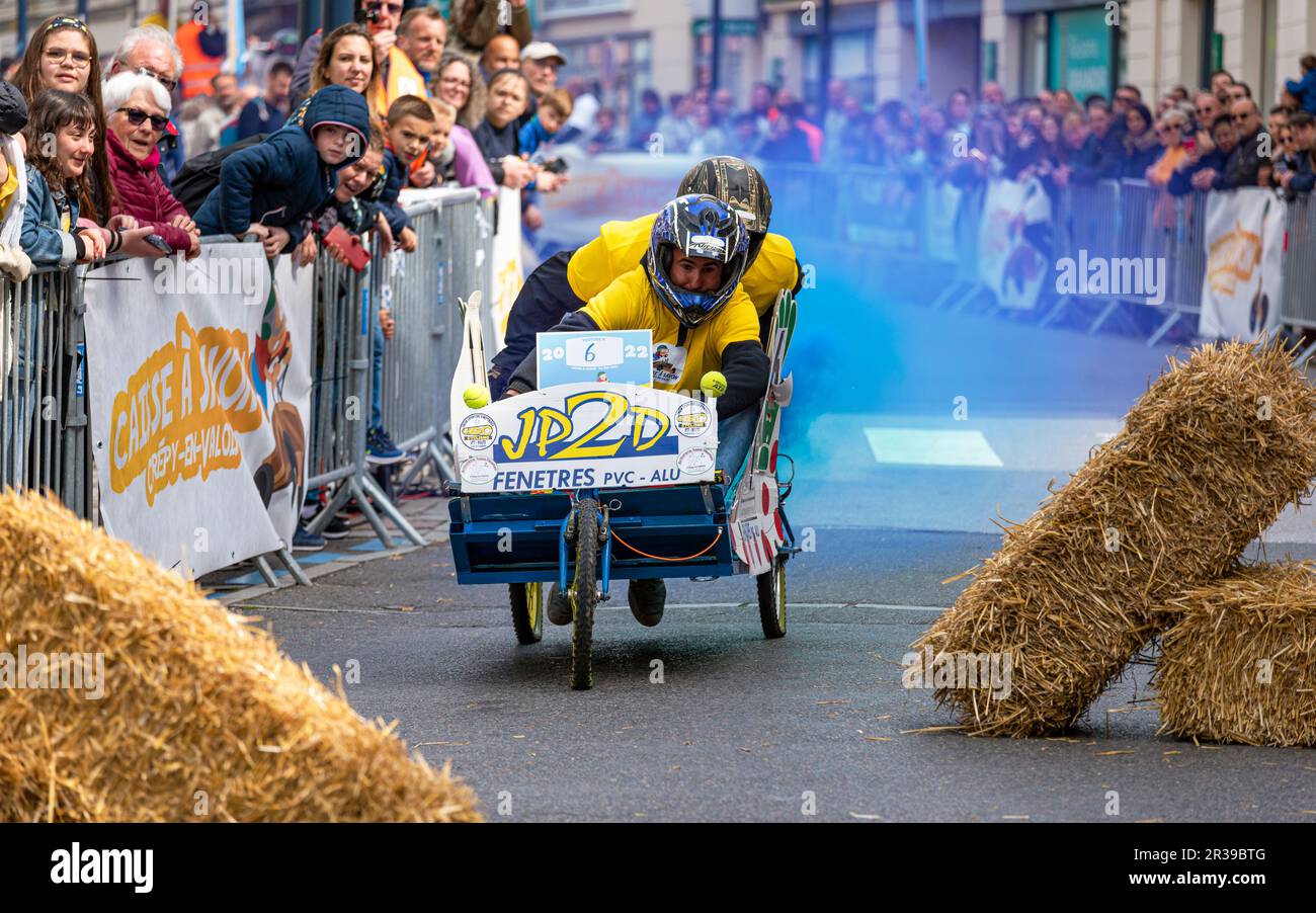 Second edition of a soapbox race in the heart of the city center of Crépy-en-Valois. Homemade soap box hurtling down the slope of the main street. Stock Photo