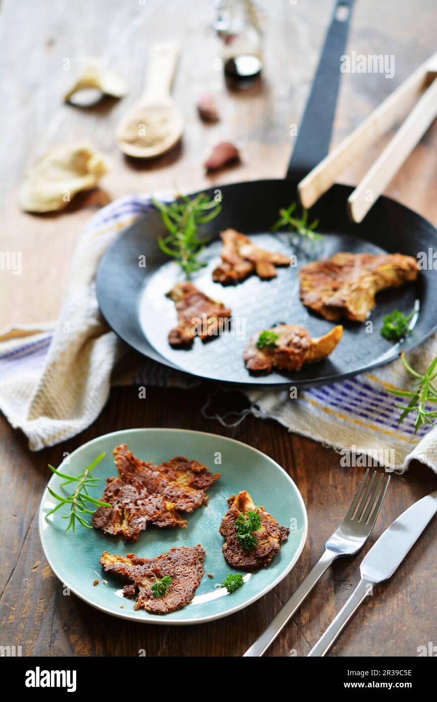 Fried oyster mushrooms in a mustard and almond coating (vegan and gluten-free) Stock Photo