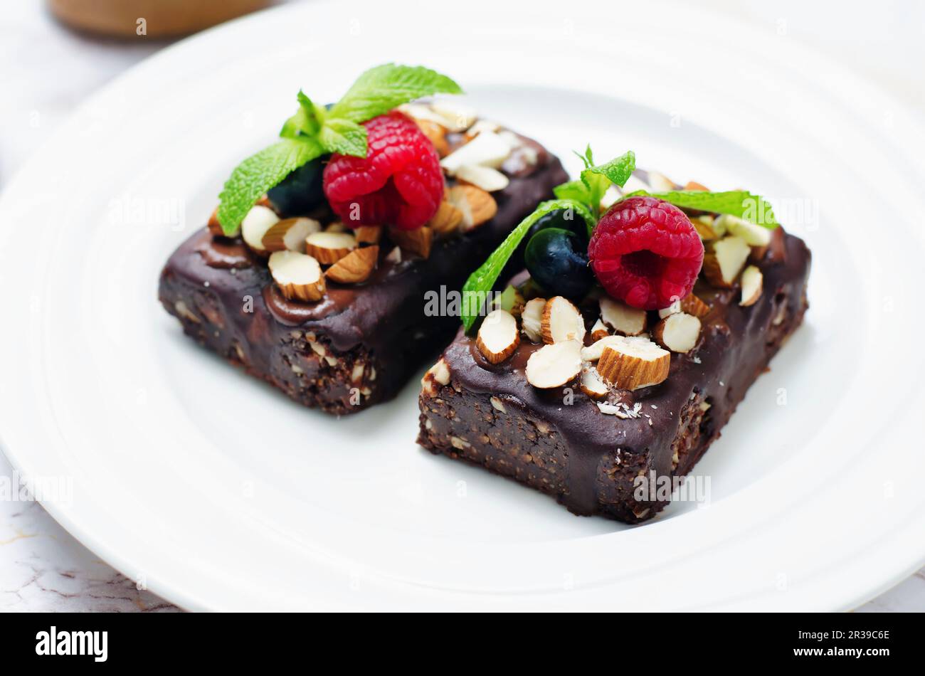 Raw vegan no bake chocolate, dates and almond brownies with chocolate