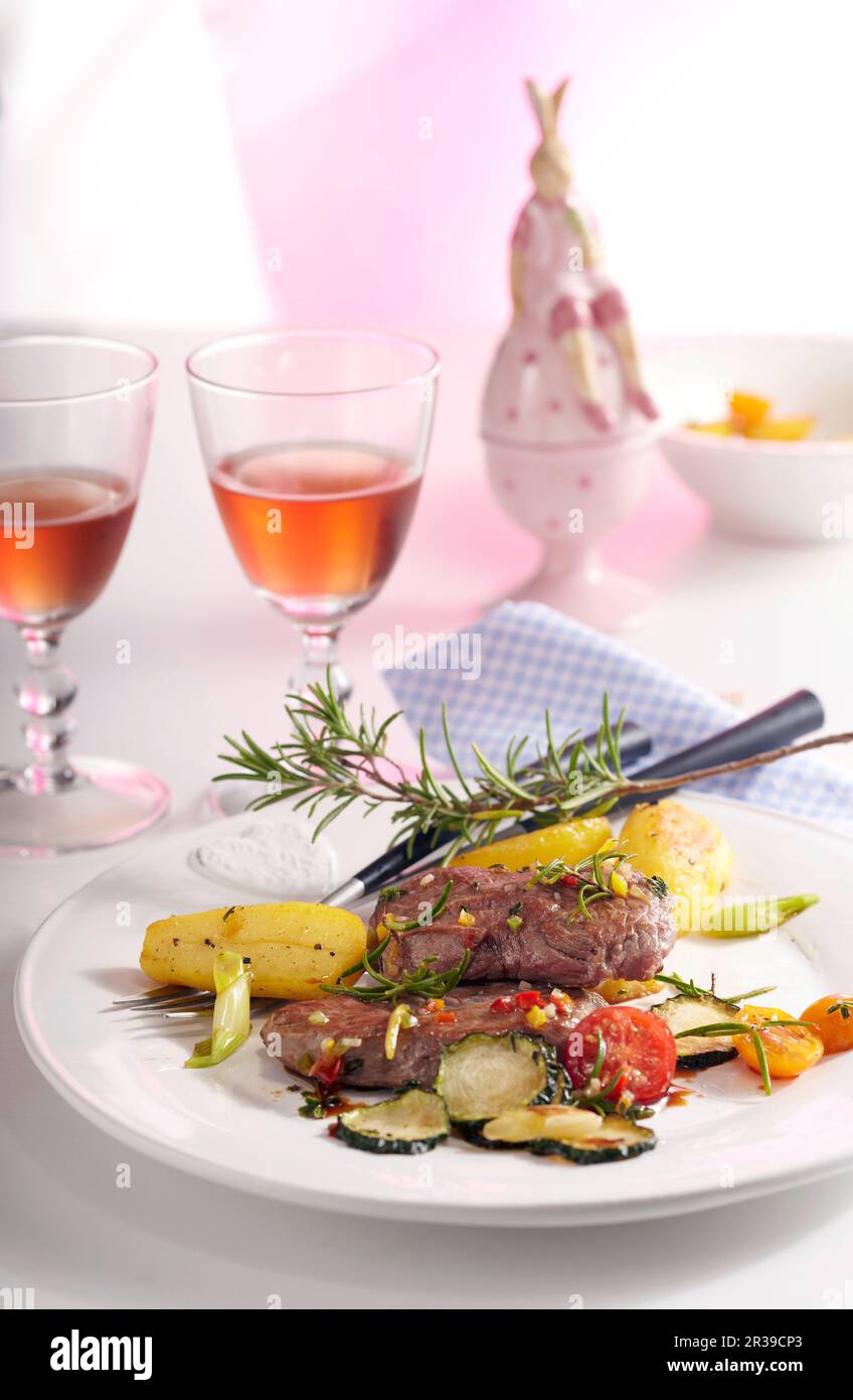 Lamb steaks in an orange and honey marinade with rosemary potatoes and