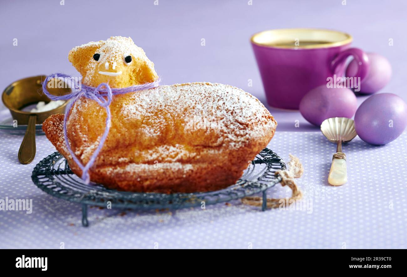 Sweet Easter lamb and purple Easter eggs Stock Photo