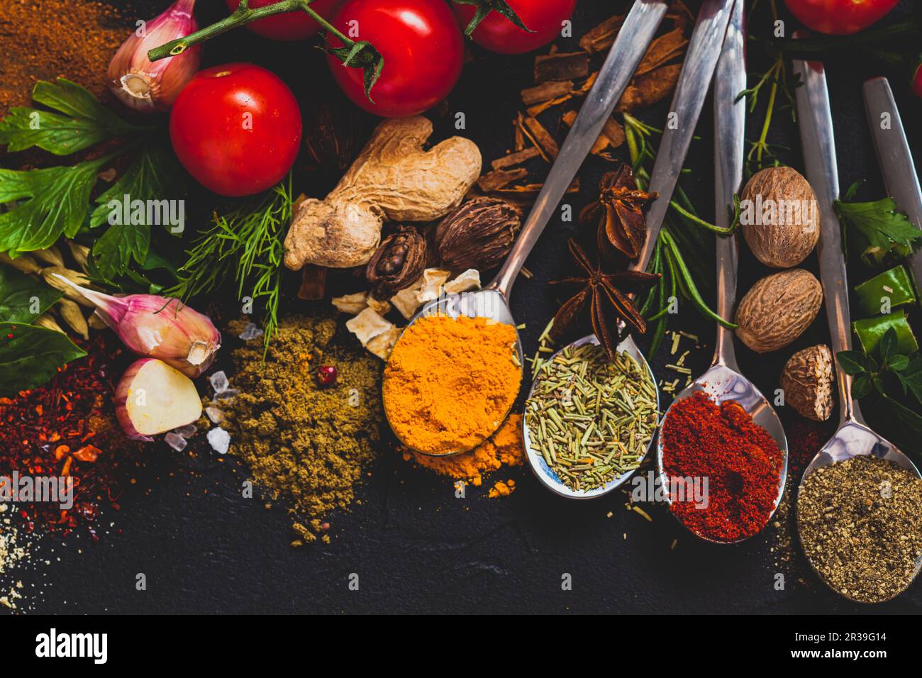 Colorful herbs and spices for cooking, close up Stock Photo