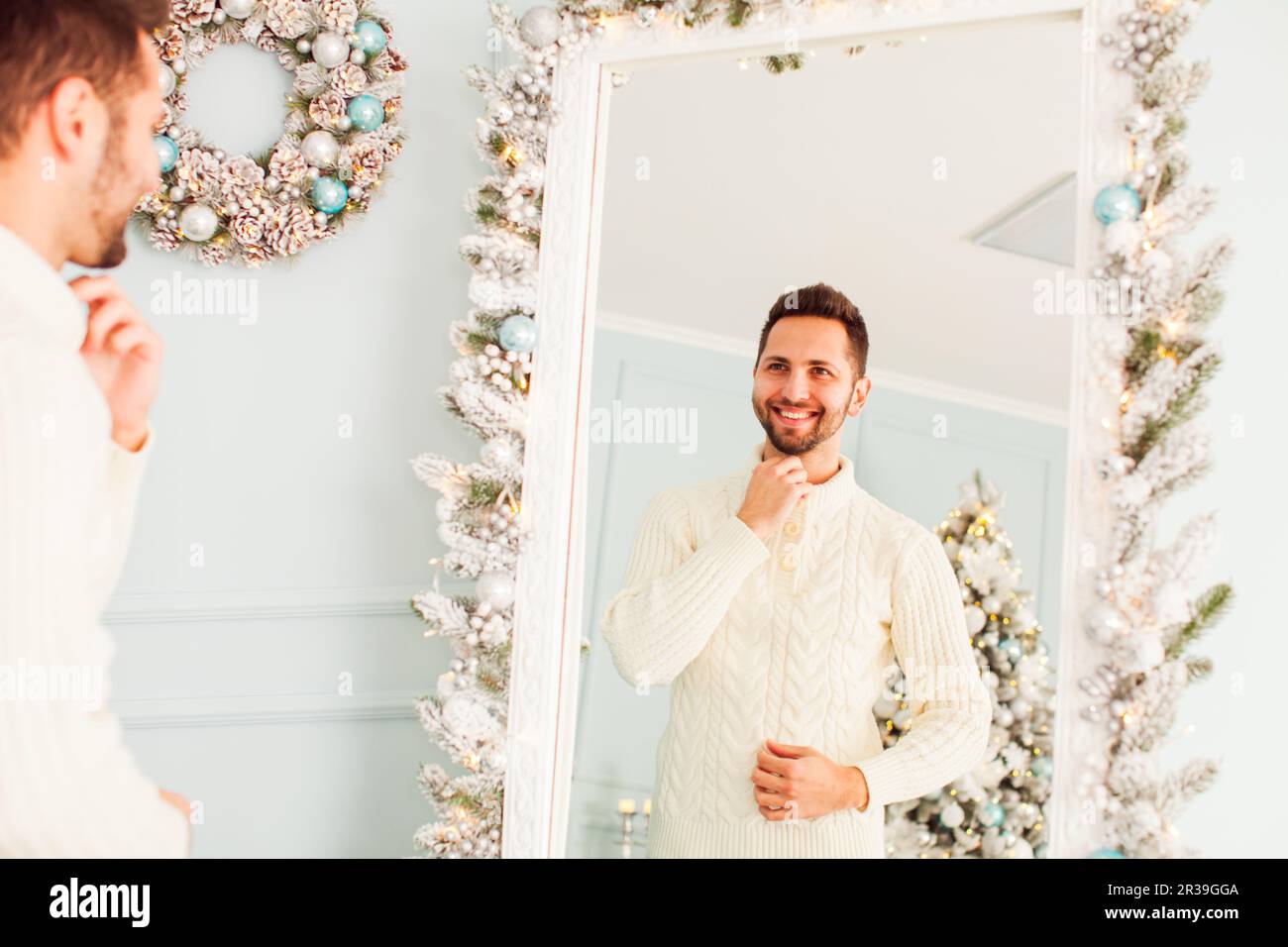 Portrait of young man near large mirror Stock Photo