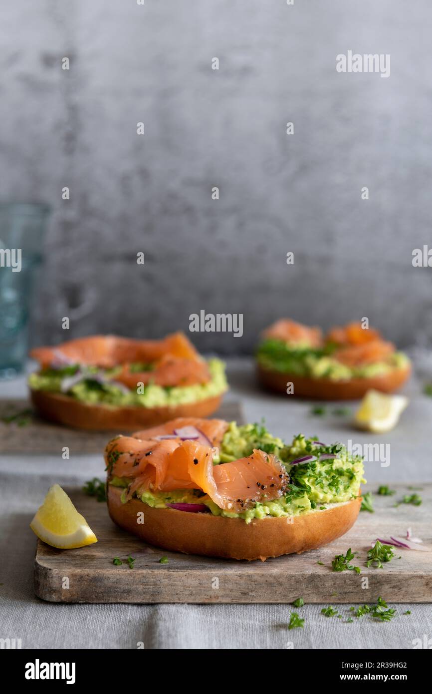 Salmon Bagels With Avocado Cream Stock Photo Alamy