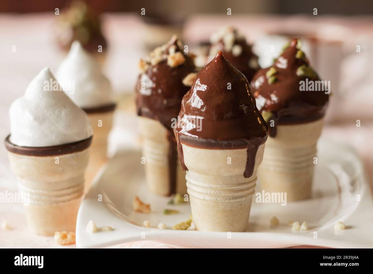 Chocolate marshmallow in ice cream cones with chocolate glaze Stock