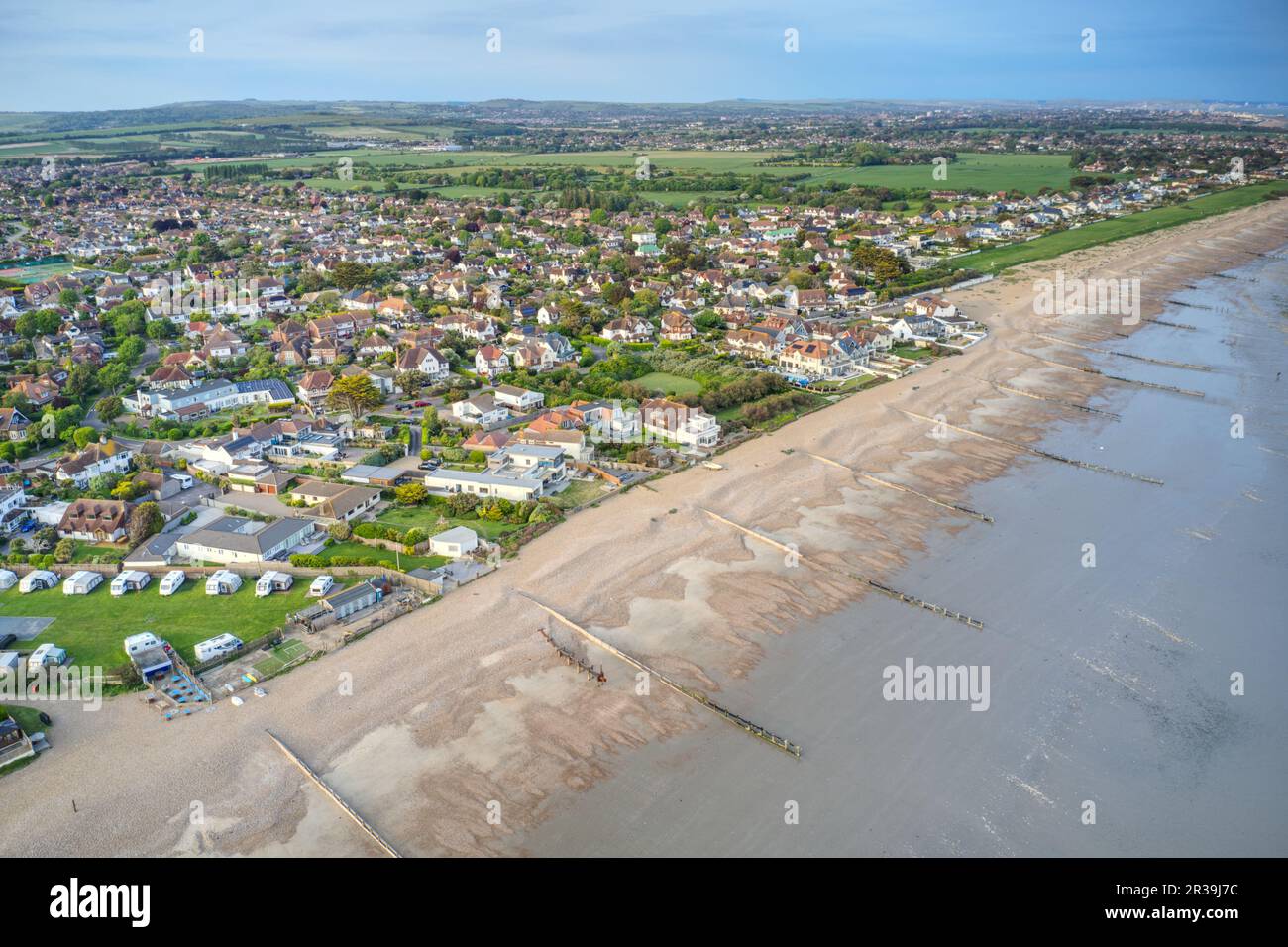 East Preston and Angmering by Sea seafront in West Sussex looking towards Kingston Gorse, Aerial photo. Stock Photo