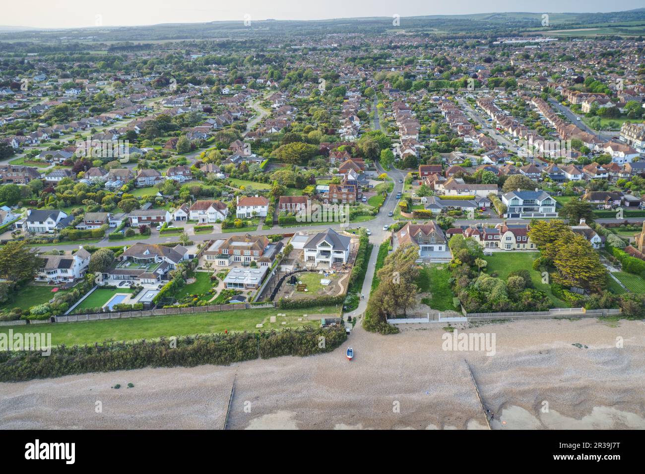 Aerial view over the West Sussex village of East Preston on the Southern Coast of England from the sea towards sea lane. Stock Photo