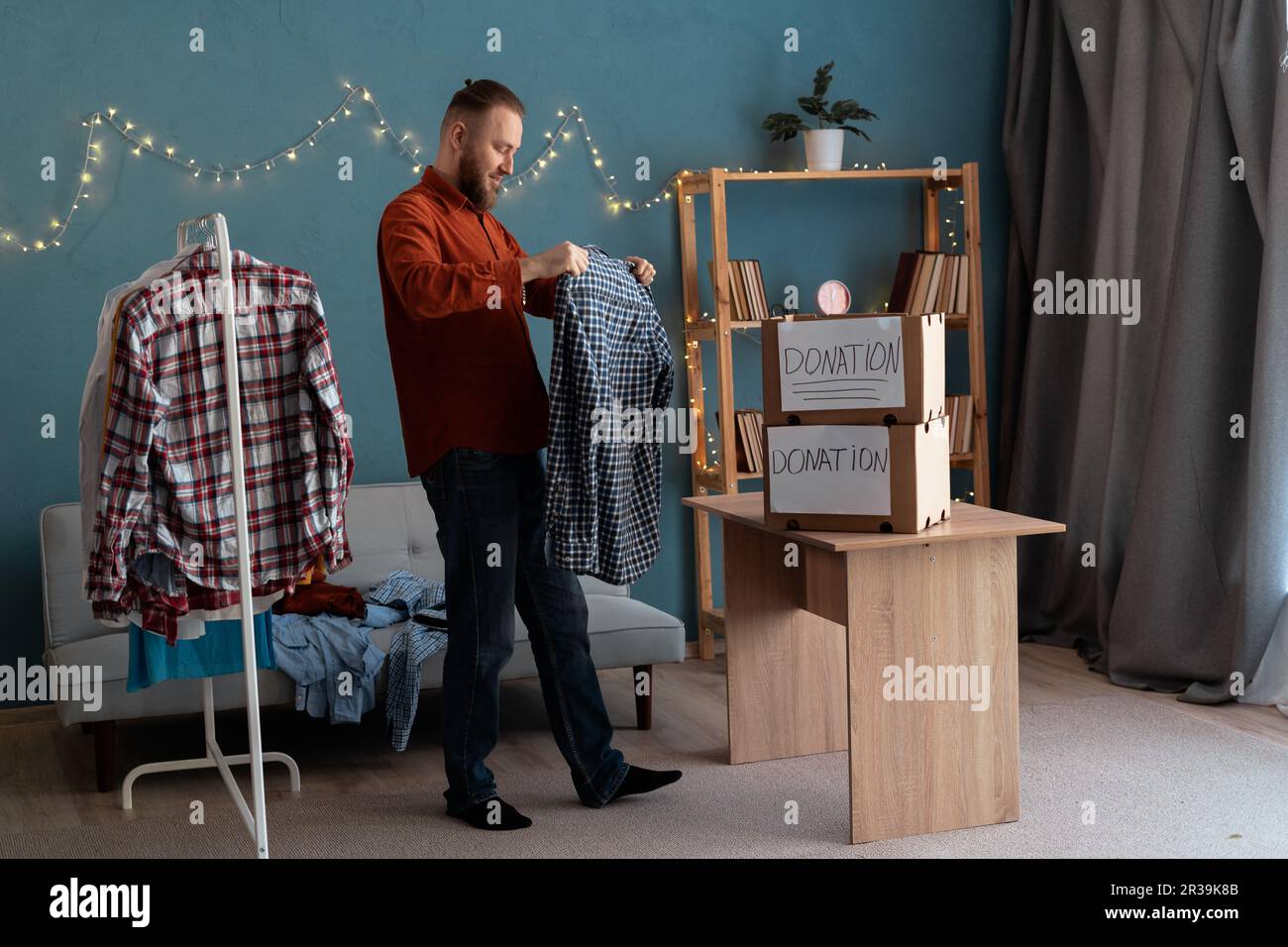 Man giving donation boxes hi-res stock photography and images - Alamy