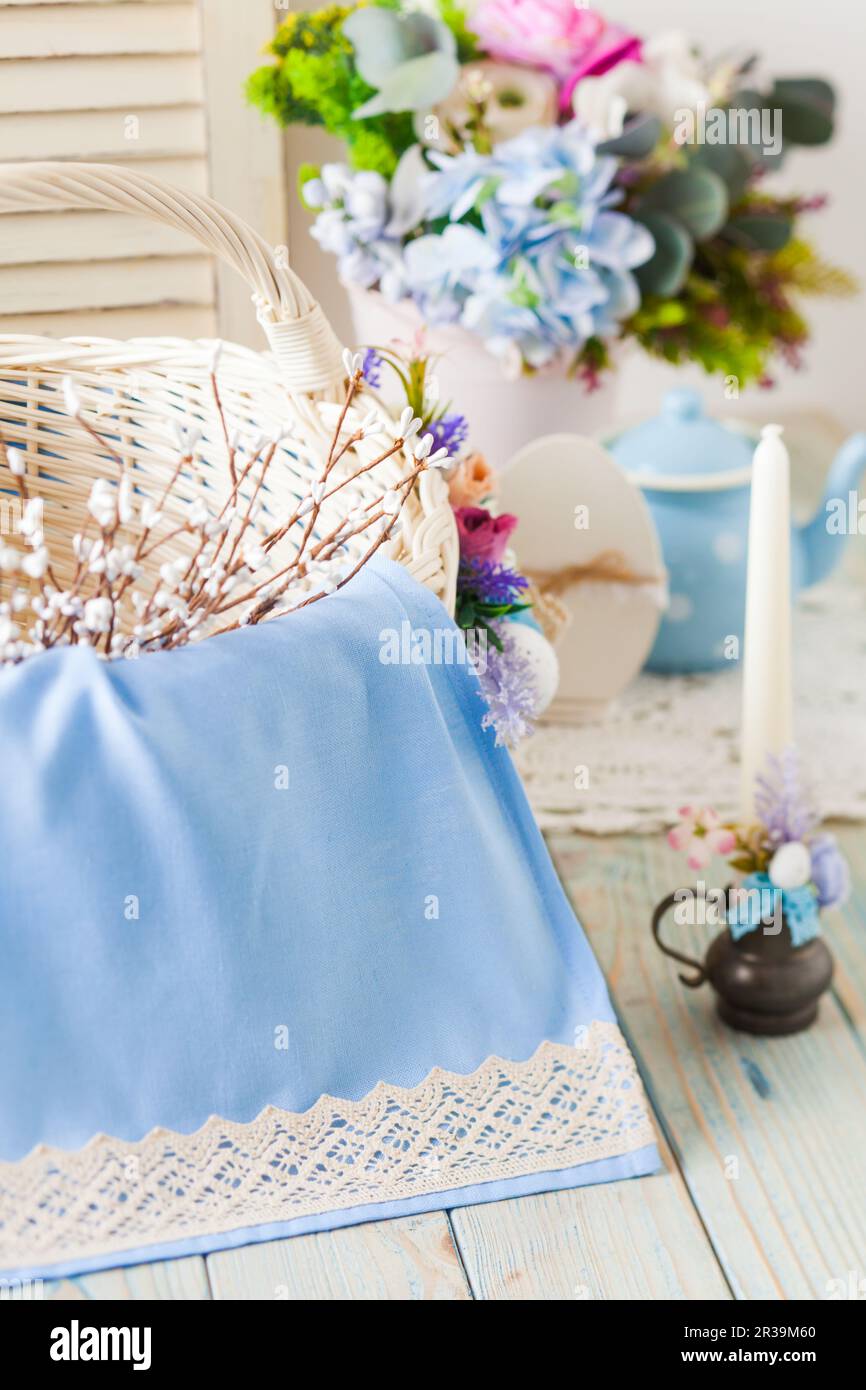 Close-up blue cloth with crocheted edging on wicker basket Stock Photo