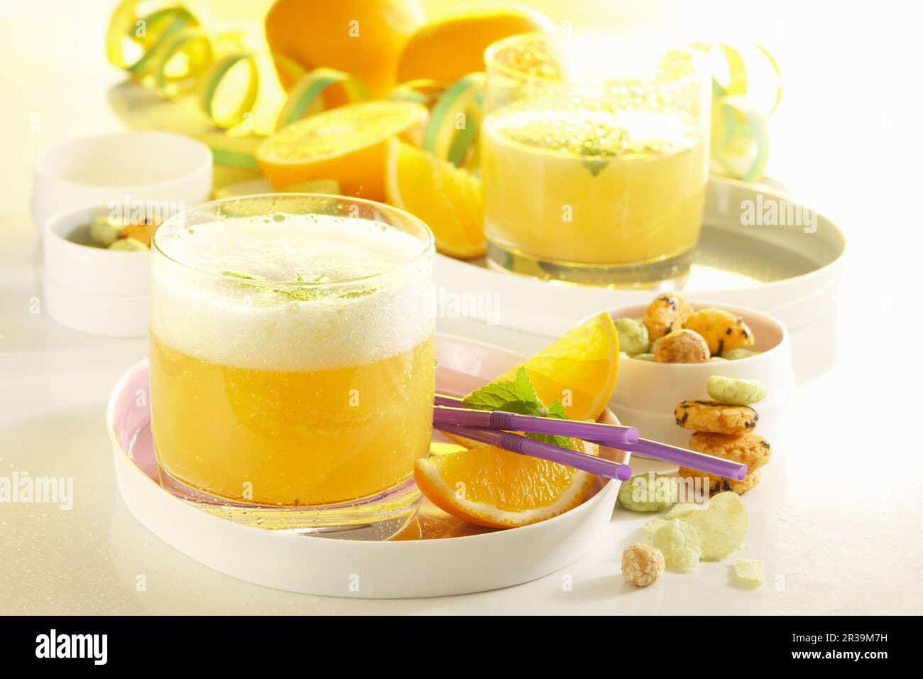 Orange punch with white rum, champagne and pineapple juice Stock Photo