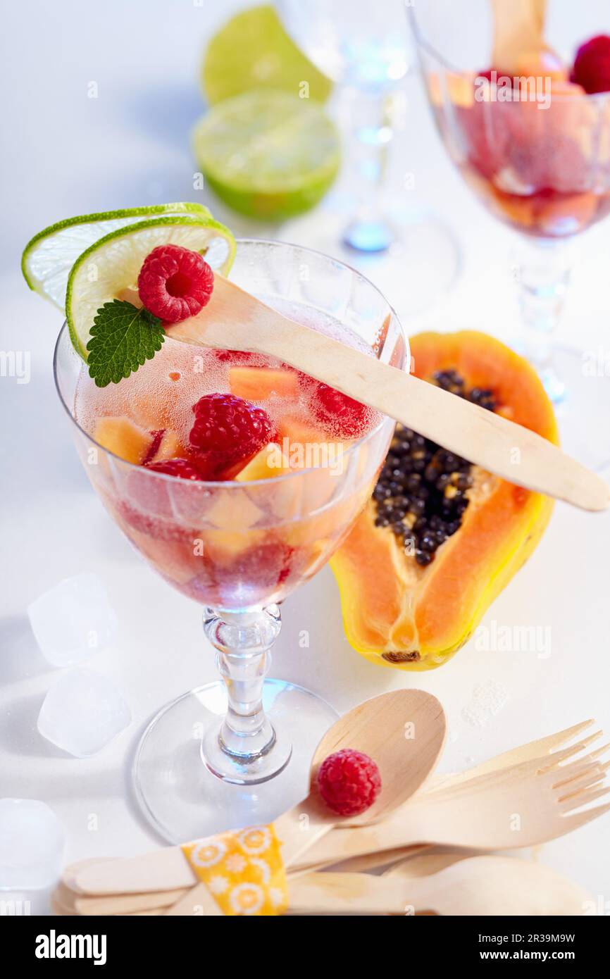 Non-alcoholic papaya and raspberry punch in glasses Stock Photo