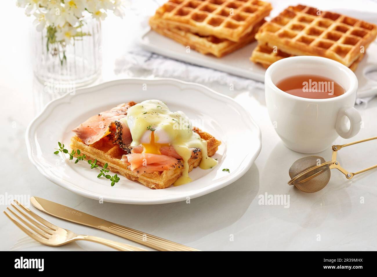 Waffle with Smoked salmon and opened poached egg Stock Photo