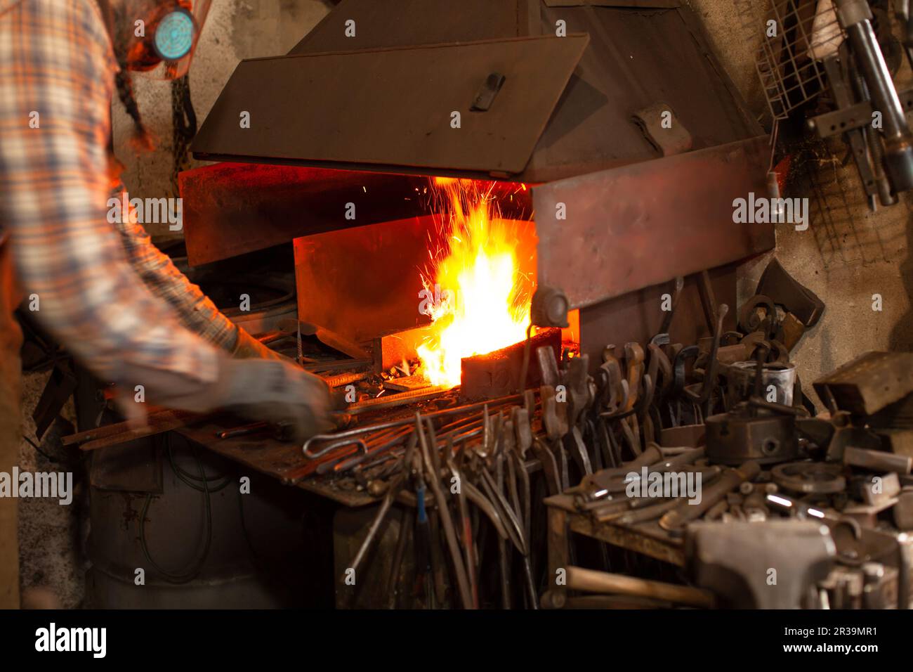 Fire of blacksmith in the blacksmith's workshop. Stock Photo