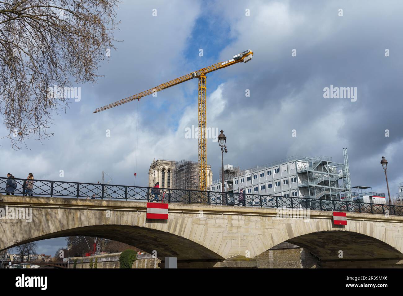 Pont de l'Archeveche (Archbishop's Bridge) with the Notre-Dame construction site in the background. Paris, France. March 24, 2023. Stock Photo